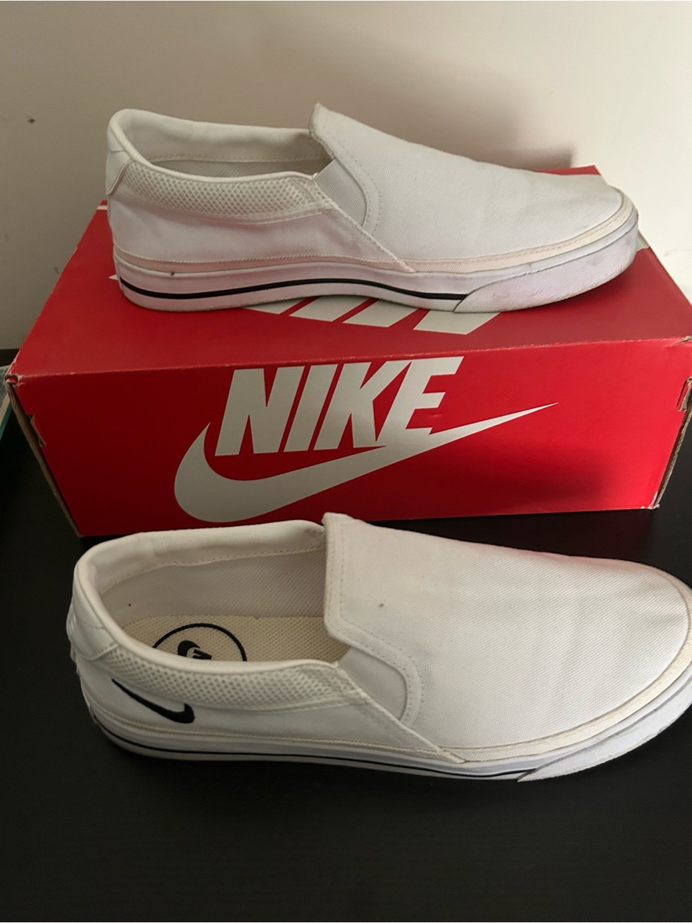 Nike Womens White Slip-On Canvas Sneakers with Black Accents